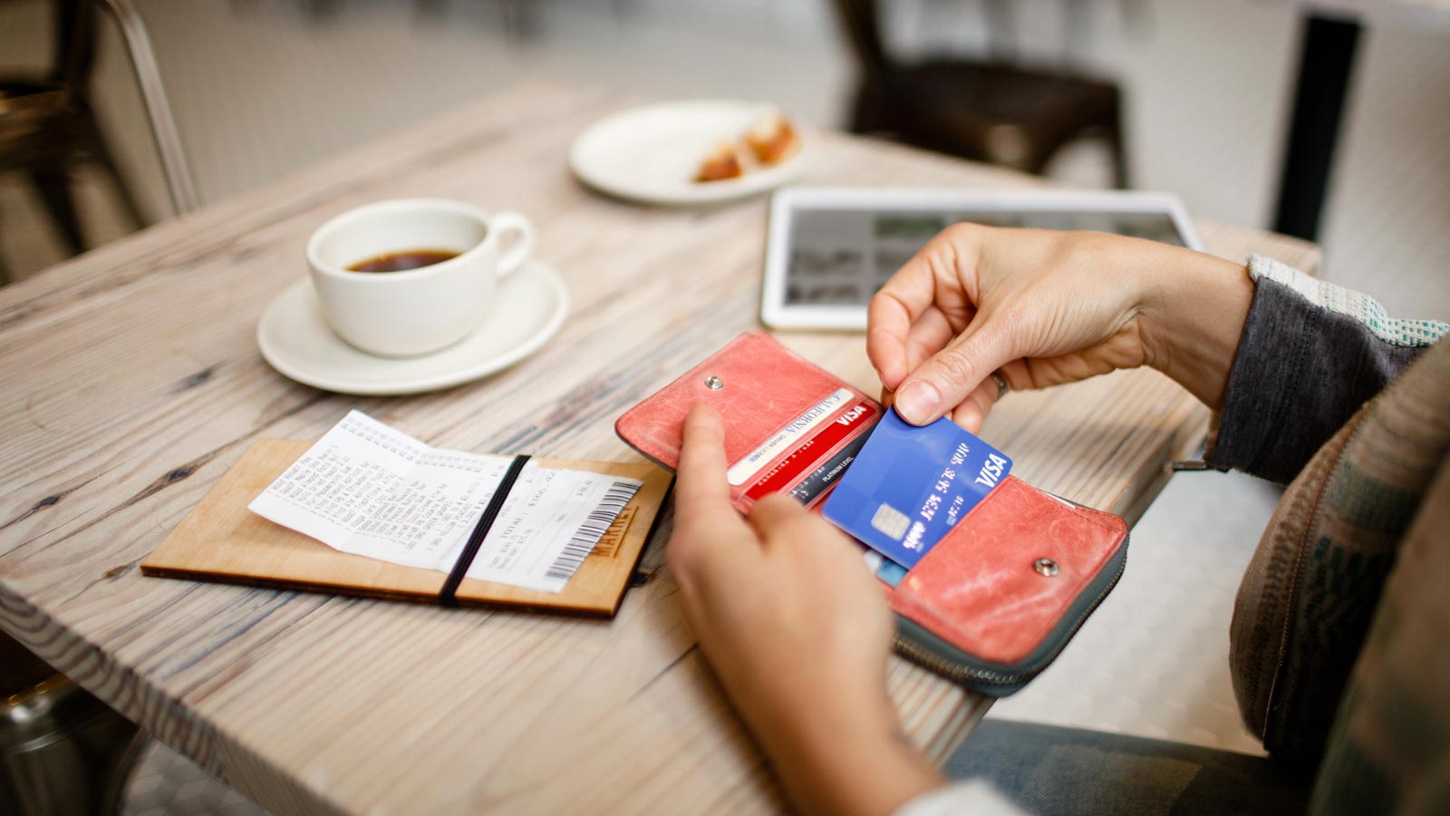 visa-credit-cards-marquee-1600x900 Person paying with credit card