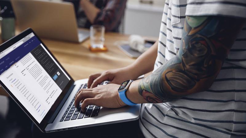 Person typing on laptop